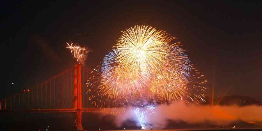 Fireworks over bridge over waterway